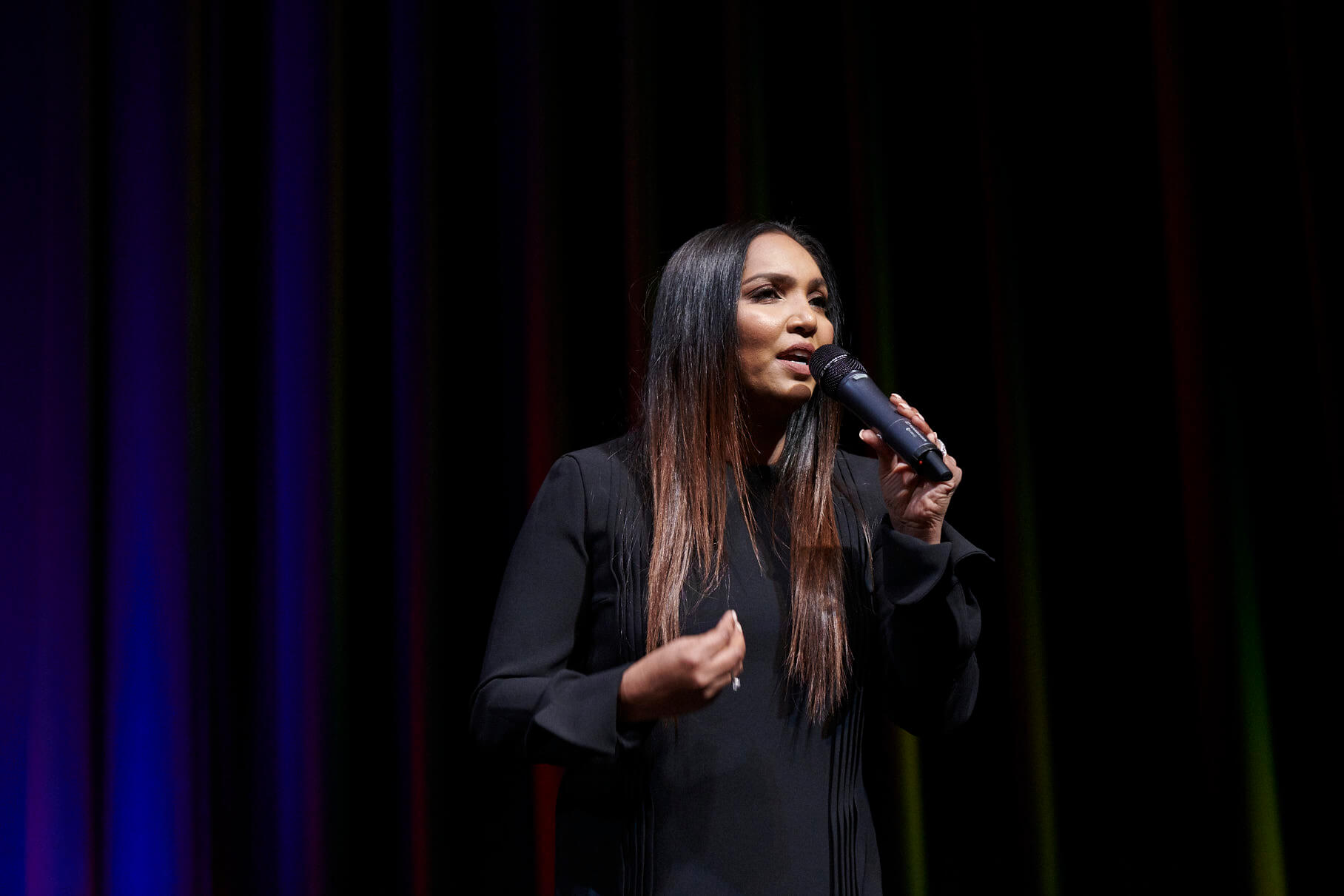 Norliza with a black microphone on the left